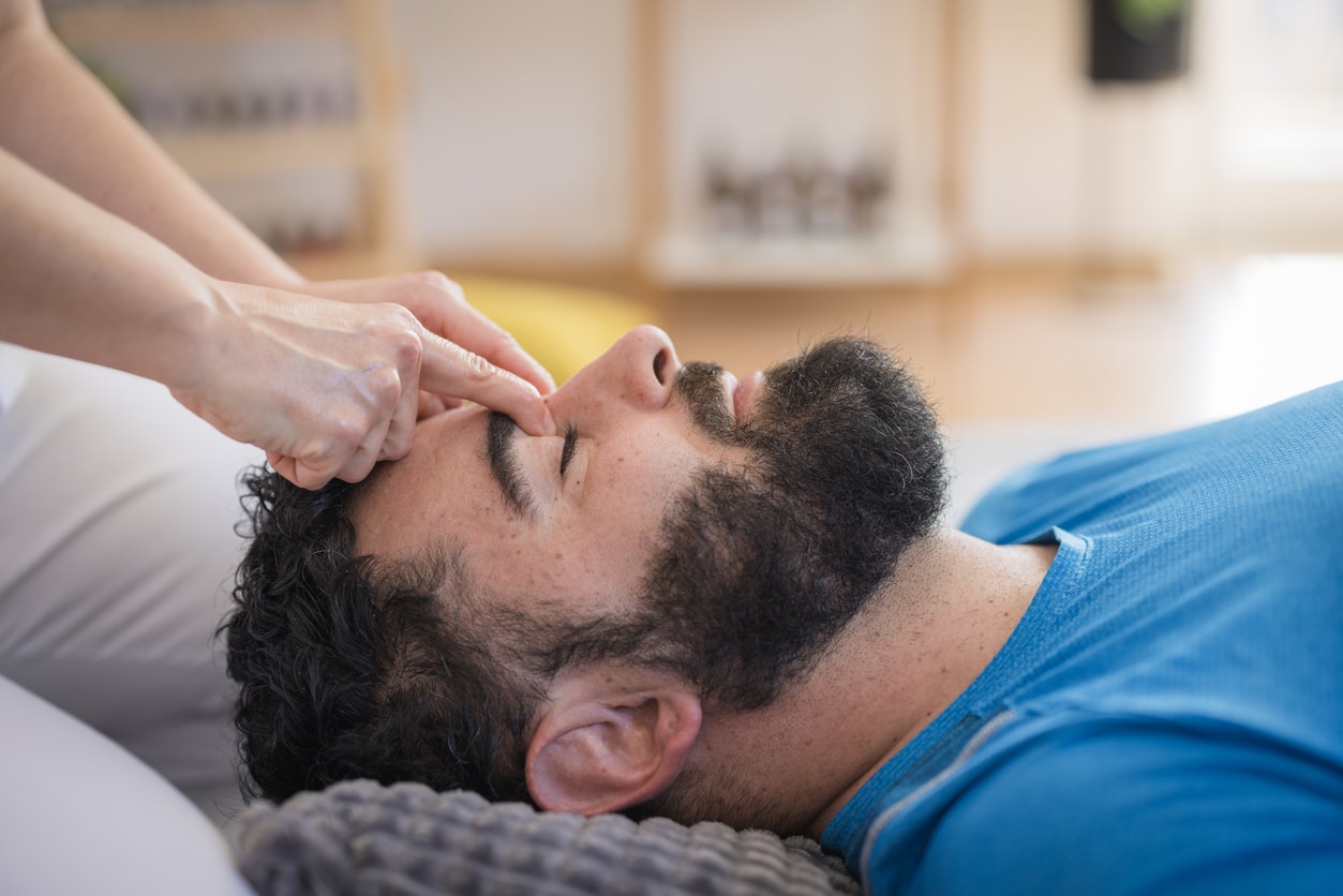 Close-up of a man receiving face massage
