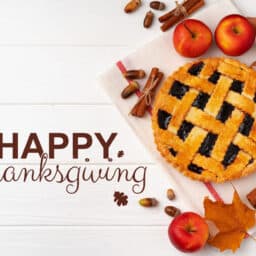 Celebrating Thanksgiving with a festive pie and seasonal decorations on a cozy table